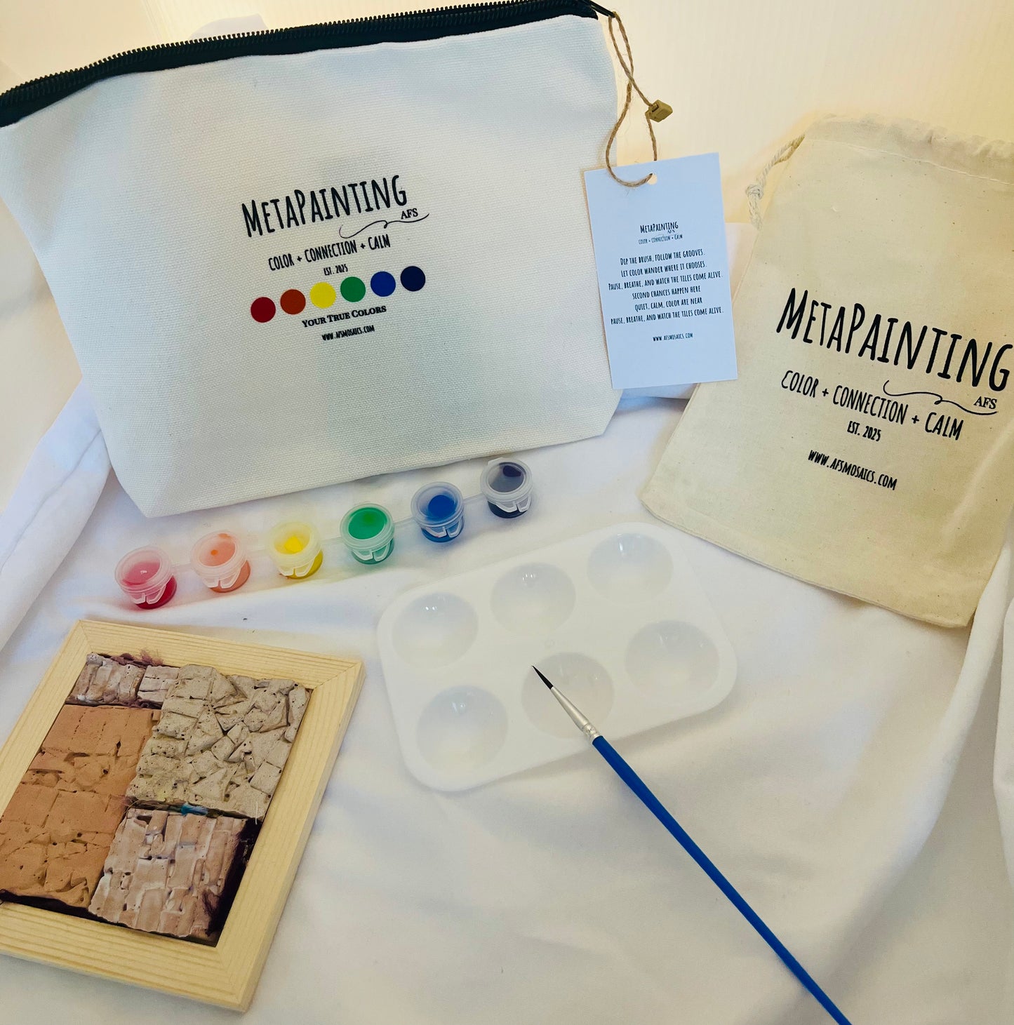 Your True Colors MetaPainting Kit with curated acrylic paint palette and hand-cast ceramic Mosaic Evolution Tile by AFS Mosaics.
 